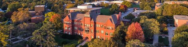 Aerial view of Old Main in the fall at dusk.